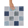 Blue, greige and green checkered tiles with white grout
