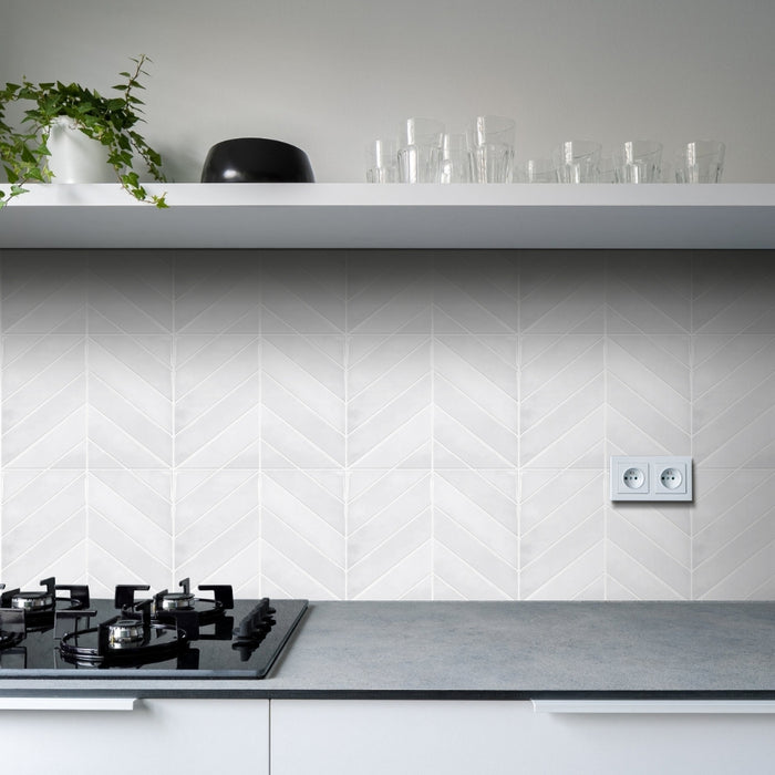 Modern kitchen with white tiled wall and grey countertop
