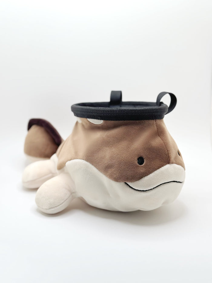 A derpy clodsire on a cute plush chalk bag for rock climbing. This functional salamander plush features a sleepy face and makes a hilarious climbing gift for climbers.
