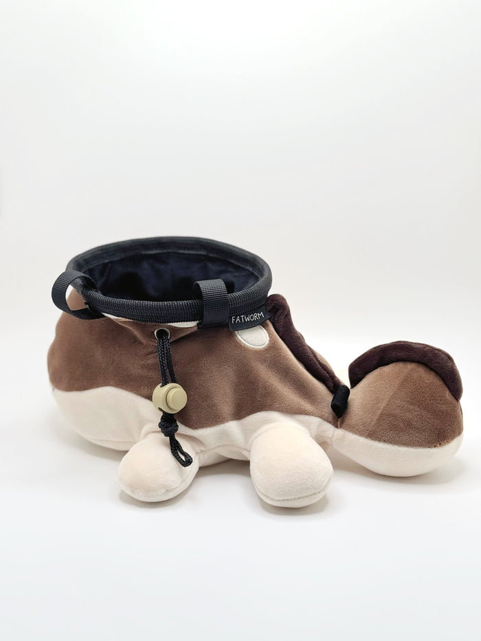 A derpy clodsire on a cute plush chalk bag for rock climbing. This functional salamander plush features a sleepy face and makes a hilarious climbing gift for climbers.