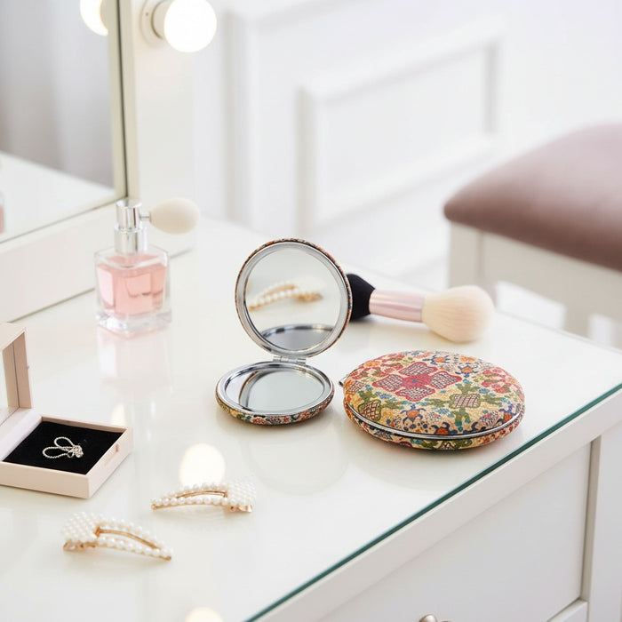 Compact Floral Pocket Mirror is Placed on  Makeup Table.