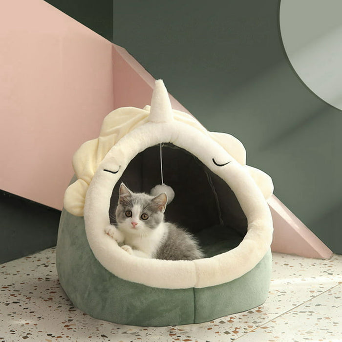 A Cat in a Cat Bed Lounger Cave.