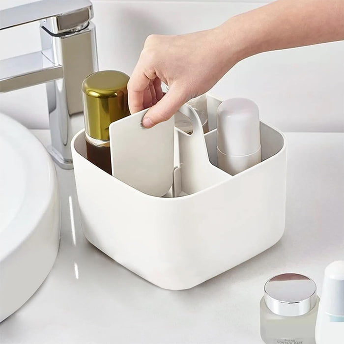 A Desk Organizer is organized with toiletries and someone is picking it.