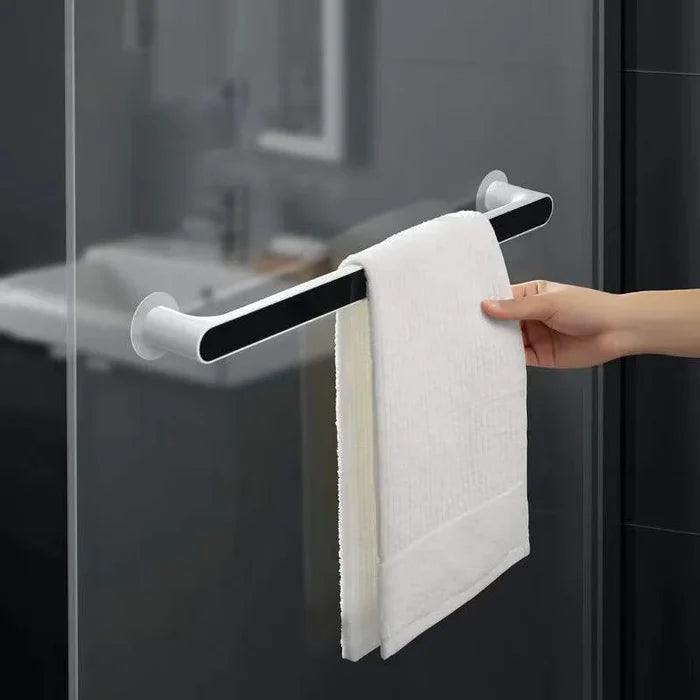 Someone is taking a towel from the Towel Organizer Hanger