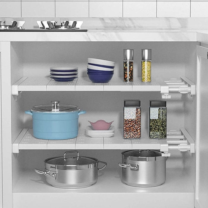 Expandable Closet Tension Shelf Divider with something arranged on it