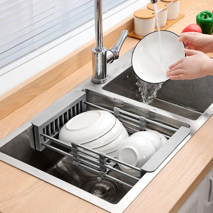 Expandable dish drying and washing basket placed next to the sink