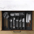 Kitchen Tableware Storage Box inside a drawer showing neatly organized knives, spoons, forks, and cooking utensils in multiple compartments.