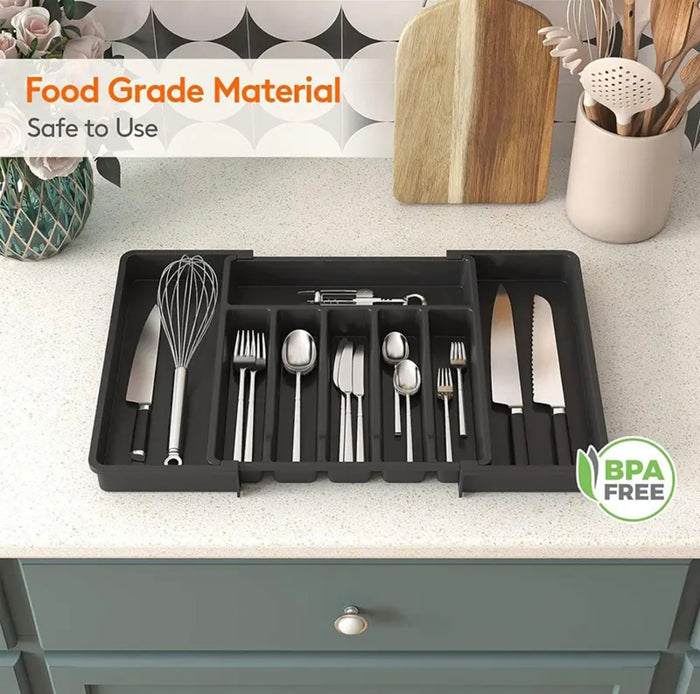 A Kitchen Tableware Storage Box showing neatly organized knives, spoons, forks, and cooking utensils in multiple compartments.