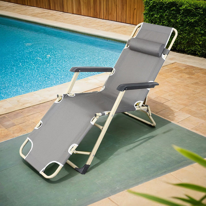 Gray lounge chair by a poolside