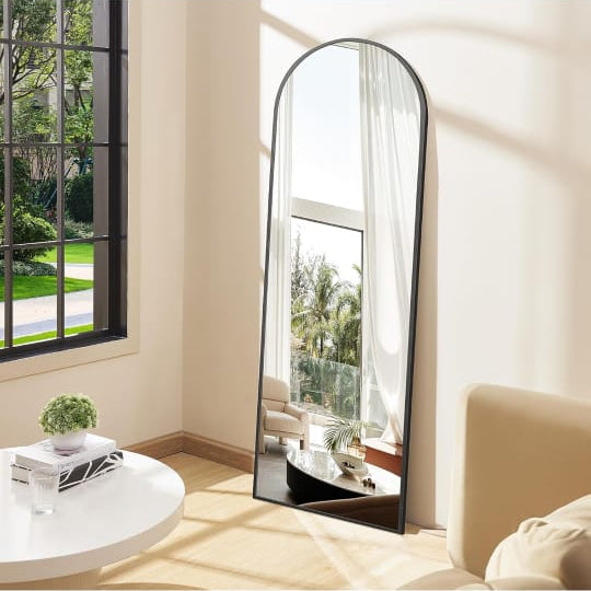 Full-Length Arched Standing Floor Mirror with Stand is Placed at the Corner Of Home.