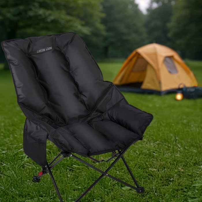 Green Lion Travix Camping Chair on grass with a tent in the background