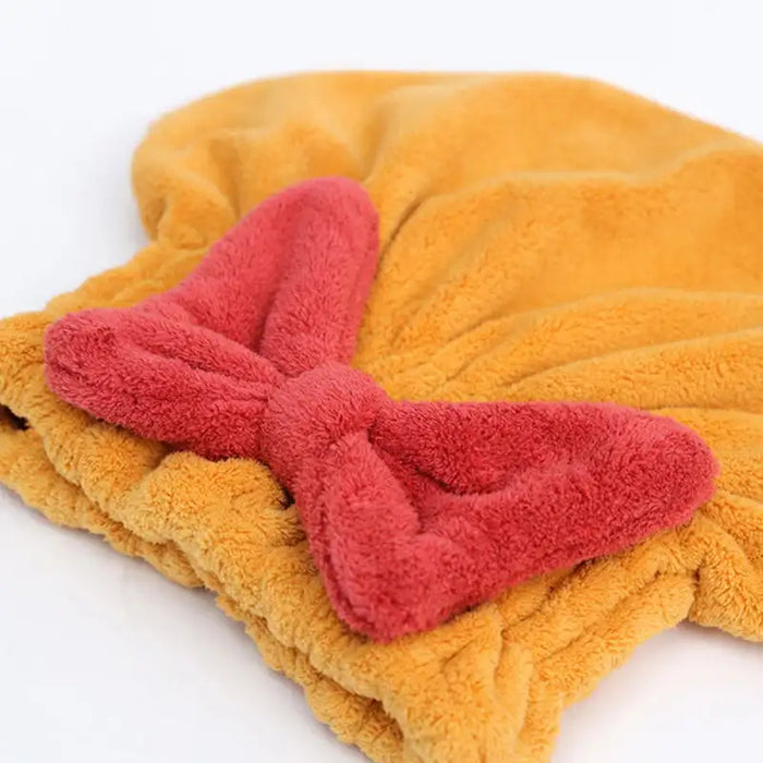 Yellow  Hair Drying Cap with a red bow on a white background