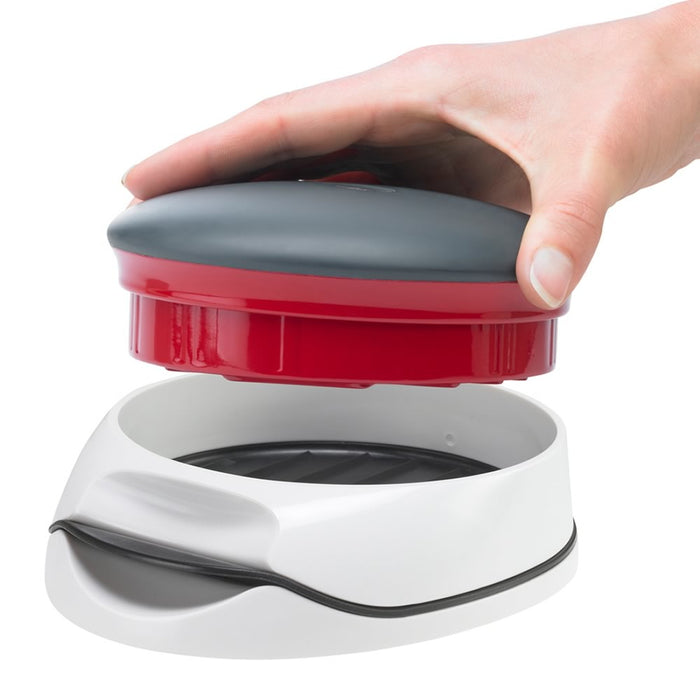 Someone holding a Hamburger Meat Presser