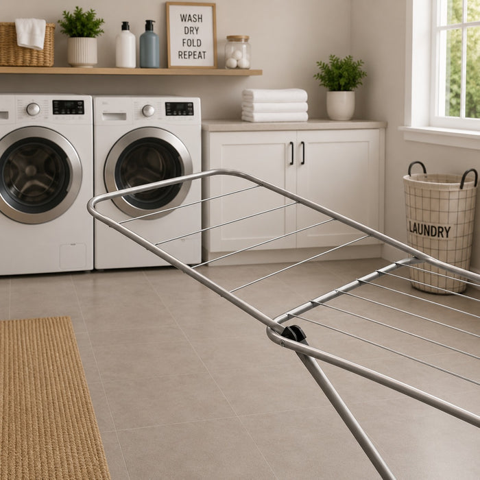 Laundry room with a Heavy Duty Foldable Clothes Drying Rack and washing machines in the background.