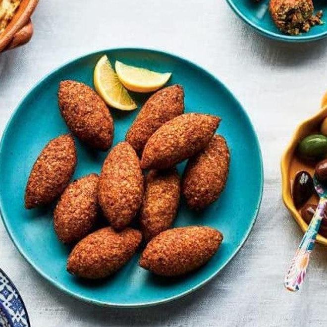 Homemade Kibbeh Maker Mold with 9 grids placed on the plates