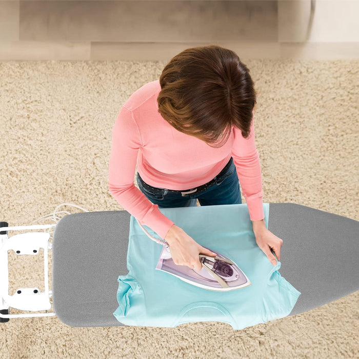 A Person is Ironing Her Clothes On Iron Board with Iron Holder.