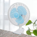 JIHAM 8-Inch Table & Clip Fan is Clipped on a Table.