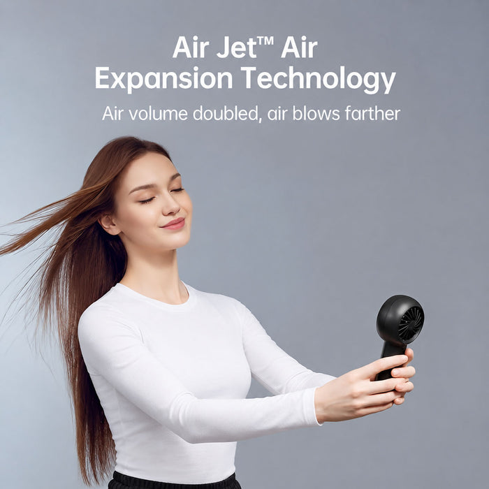 A woman with long brown hair wearing a white long-sleeve top holds a JisuLife Handheld Fan Life5 Plus  against her hair, with text at the top reading 'Air Jet Air Expansion Technology' and 'Air volume doubled, air blows farther.'.