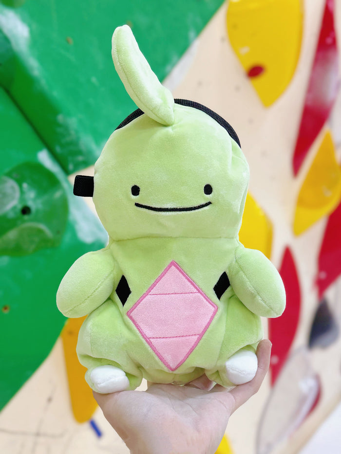 Handmade green and red plush Larvitar rock eater climbing chalk bag with a minimalist mimic face. Cute and unique climbing gift by Fatworm.