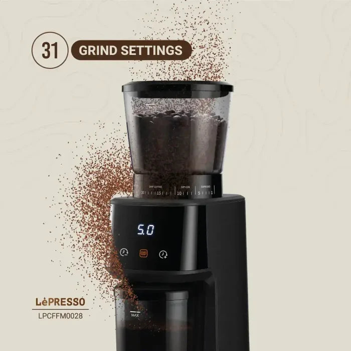 Lepresso AeroGrind Conical Burr Coffee Grinder with ground coffee beans artistically splashing and floating around it, highlighting its function, with top text emphasizing “31 GRIND SETTINGS.”