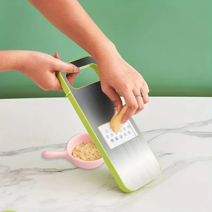 A slicer slicing vegetable.