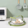Microwave Oven Splatter Cover With Handle is Placed Near Oven..