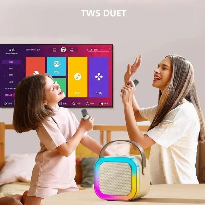Mother and Daughter Enjoying Using Mini Bluetooth Speaker With Wireless Karaoke Microphone.