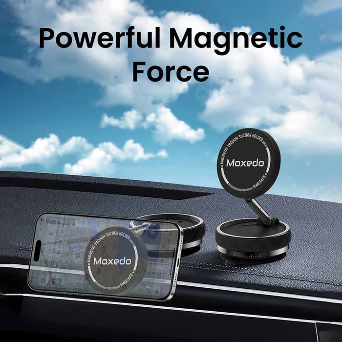 Moxedo Snap-On  Magnetic Vacuum Suction Holder Placed On a Car Dashboard.