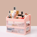 Pink cosmetic organizer with various products on a beige background