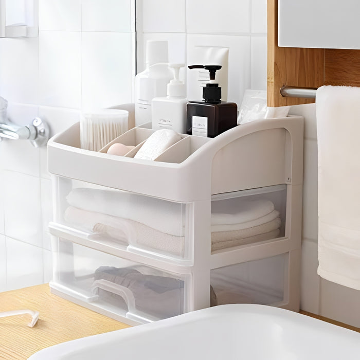 Multi-Compartment Makeup Organizer with transparent drawers in a bathroom setting.