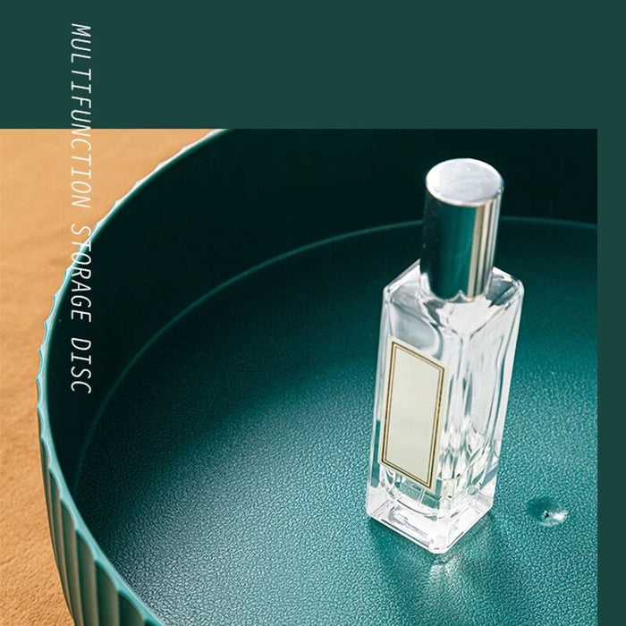 A bottle of perfume in a Multi-Purpose 360° Rotating Storage Tray