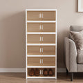 Multi-Tiered Shoe Storage Cabinet with Shoes Beside a Sofa Set.