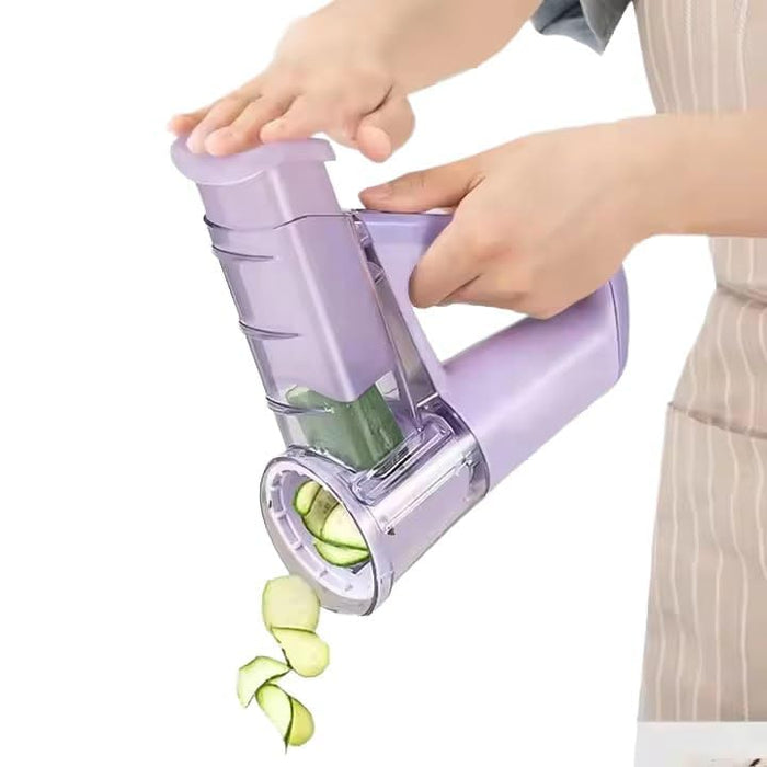 A Person is Slicing Cucumber Using  Electric Vegetable Cutter & Salad Maker.