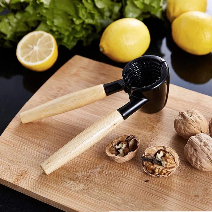 Nutcracker Tool placed on top of a cutting board near to cracked nuts and lemons
