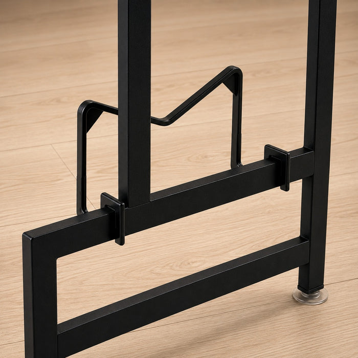 Close-up of a black metal base frame or stand base with support brackets and clear round feet of Over-Sink Dish Drying Rack, shown on a light wood floor.