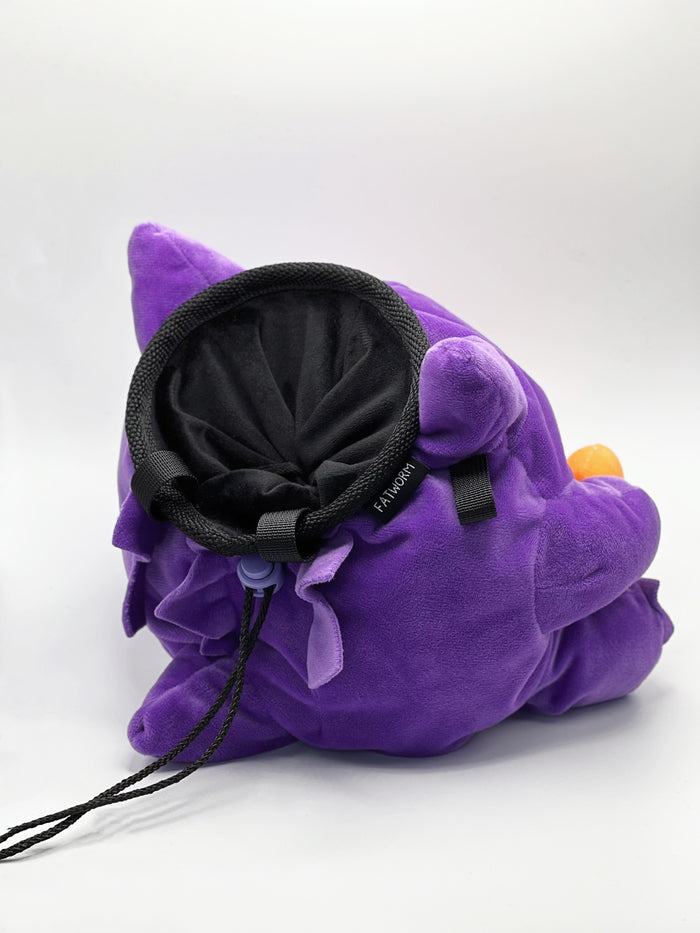 A cute anime plush chalk bag by Fatworm featuring Gengar holding a peanut. This functional and fluffy accessory is handmade for bouldering and climbing for rock climbing, offering a long-durable design that makes the perfect climbing gift for a climber.