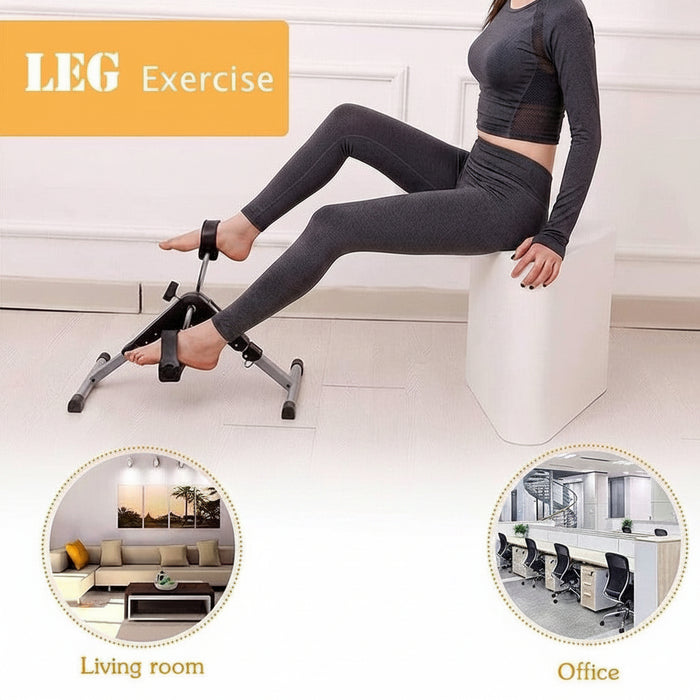 A woman is using a compact pedal exerciser while seated, performing a leg workout.
