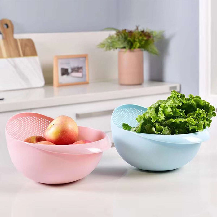 Two Plastic Rice Washing Strainer Baskets with fruits and vegetables in it placed on a kitchen counter top