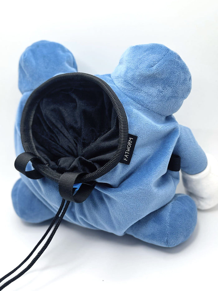 A cute anime plush chalk bag by FATWORM featuring a blue tadpole with a black and white swirl on its belly and white gloves. This functional and fluffy bouldering accessory is handmade for bouldering and climbing for rock climbing, offering a long-durable design that makes the perfect climbing gift for a climber.