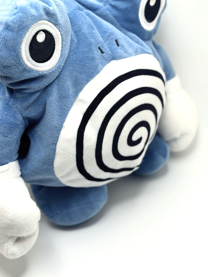 A cute anime plush chalk bag by FATWORM featuring a blue tadpole with a black and white swirl on its belly and white gloves. This functional and fluffy bouldering accessory is handmade for bouldering and climbing for rock climbing, offering a long-durable design that makes the perfect climbing gift for a climber.