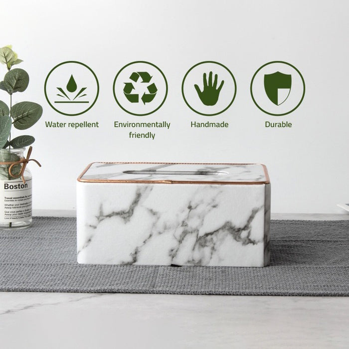 Rectangular Tissue Box Holder, placed on a sheet next to a vase of flowers, showcasing its various features