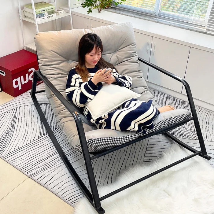 a woman lies on a Relaxing Rocking Chair,