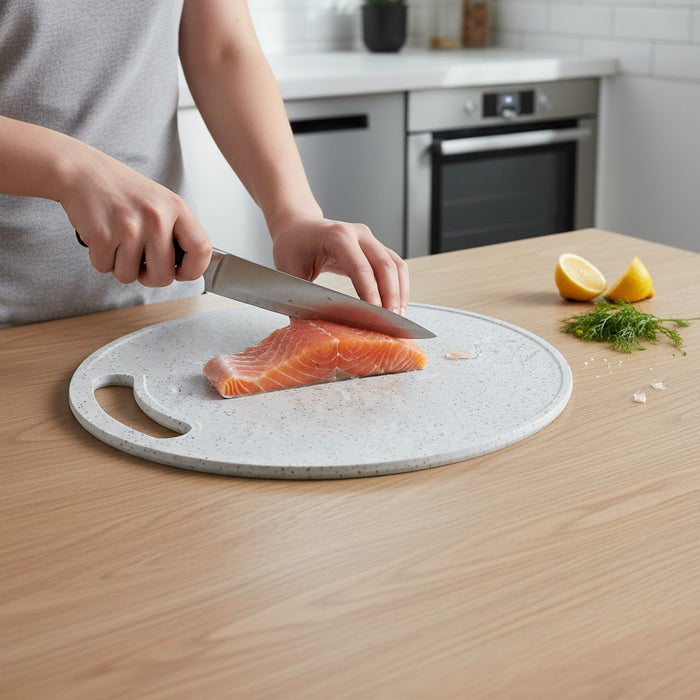 A Person is Cutting Meat Using Chopping Board.