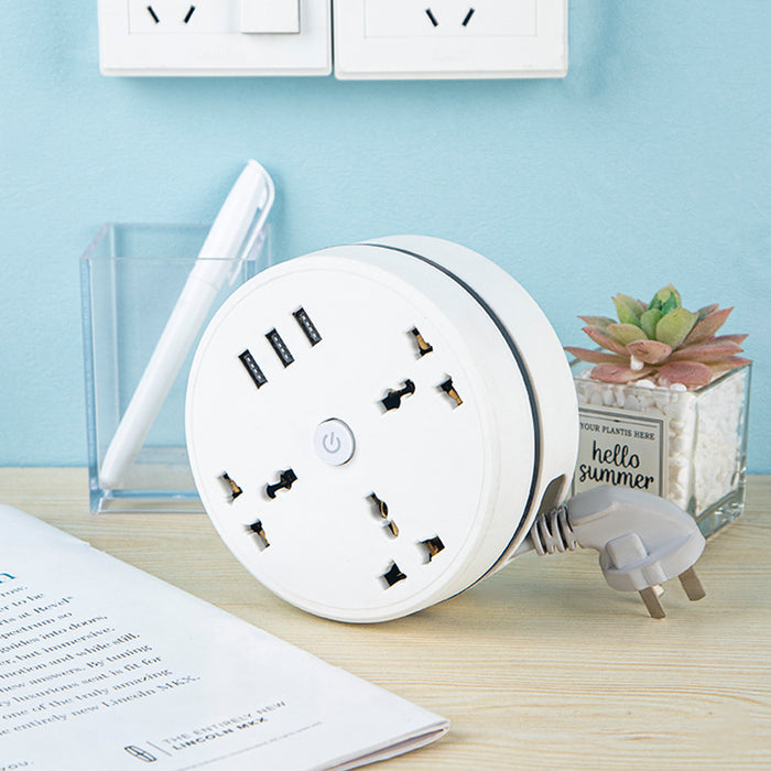 Round Universal Converter Power Strip Adapter - Extension Socket 3 Outlets with 3 USB Ports placed on desk