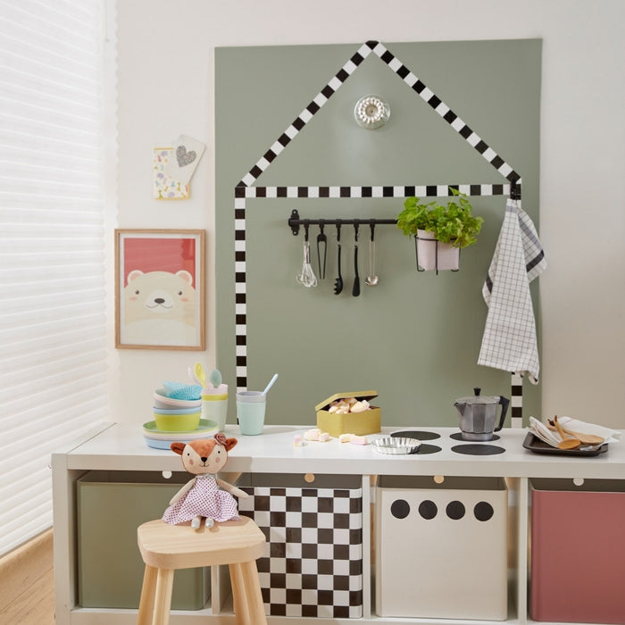 A play kitchen with vinyl wrapped features.