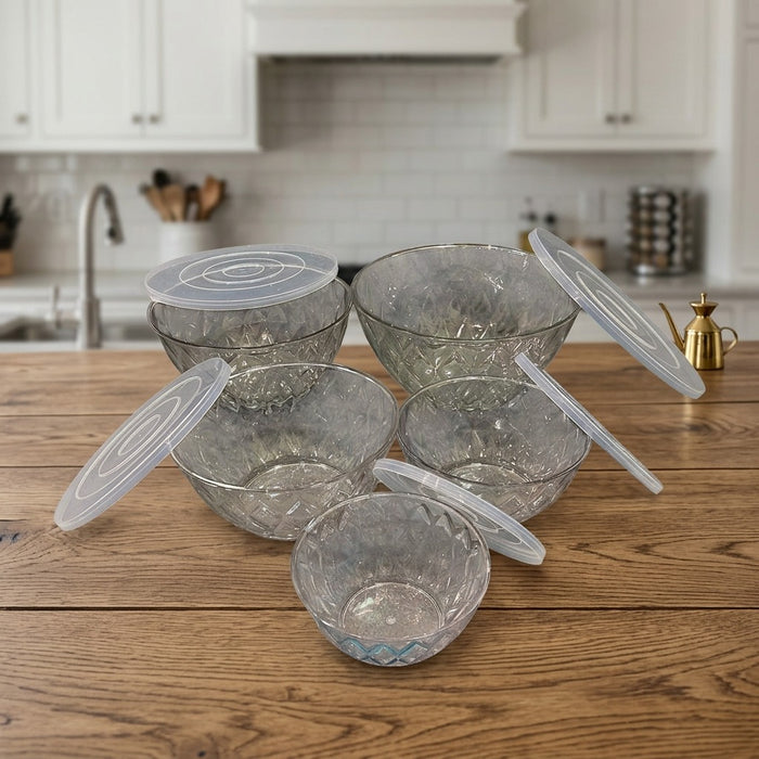 Set of glass bowls with lids on a kitchen counter