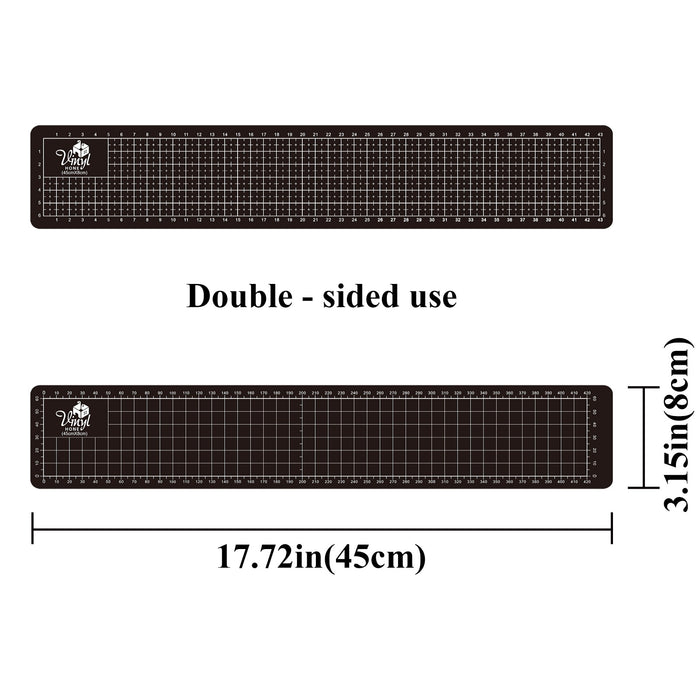 Black cutting mat with grid lines and measurements on a white background