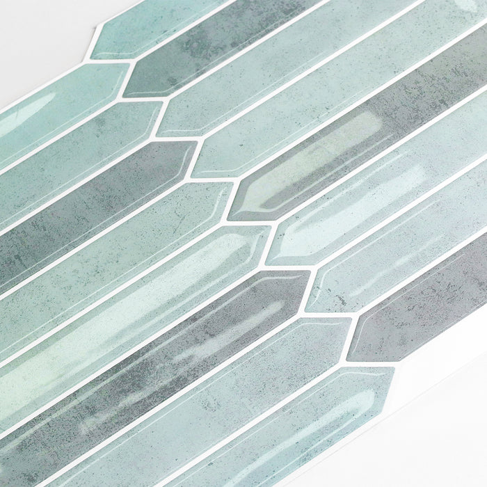 Geometric pattern of blue and gray tiles on a white background