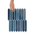 Hexagonal blue tiles with a hand holding one tile on a white background