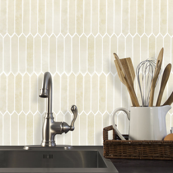 Kitchen sink area with geometric tile pattern on the wall